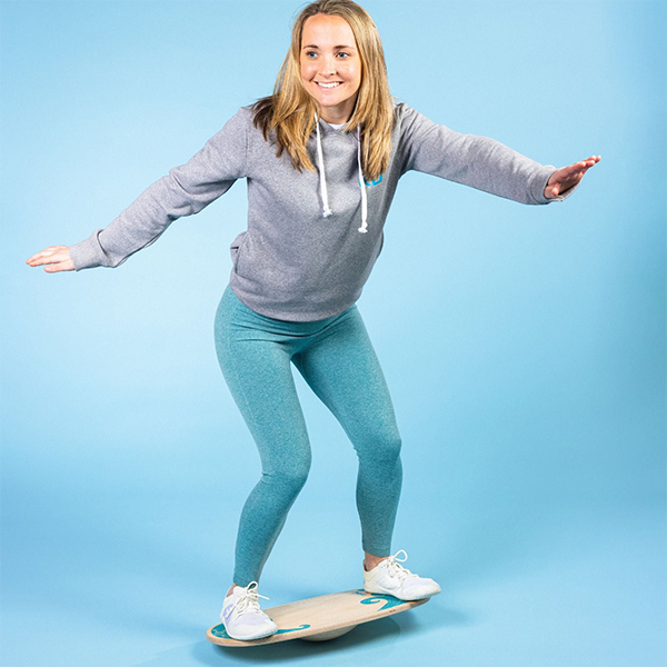 Woman on wobble board
